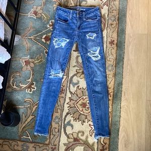 American Eagle Outfitters US size 0 light blue distressed jeggings